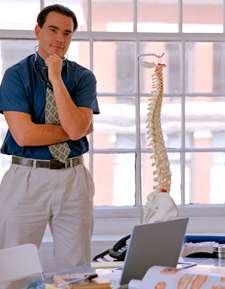 Chiropractor in his office